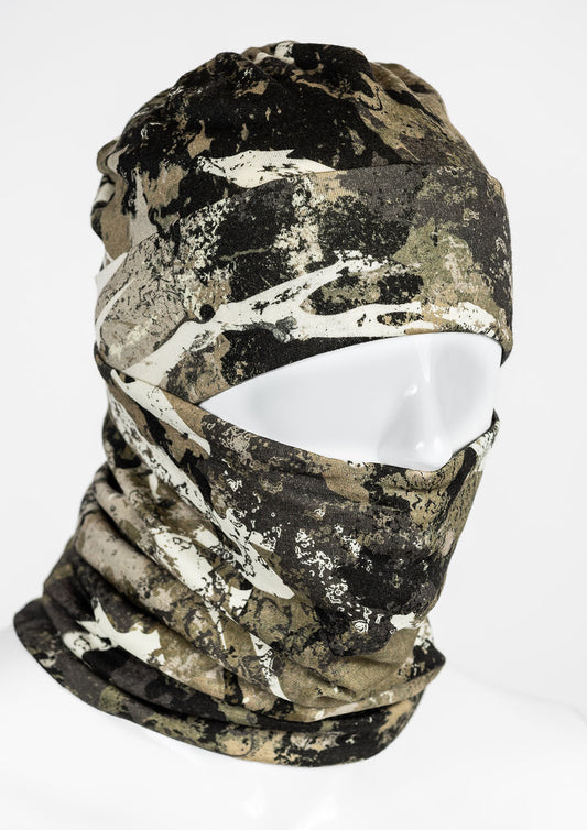 A camouflage patterned merino wool neck gaiter shown on a mannequin.